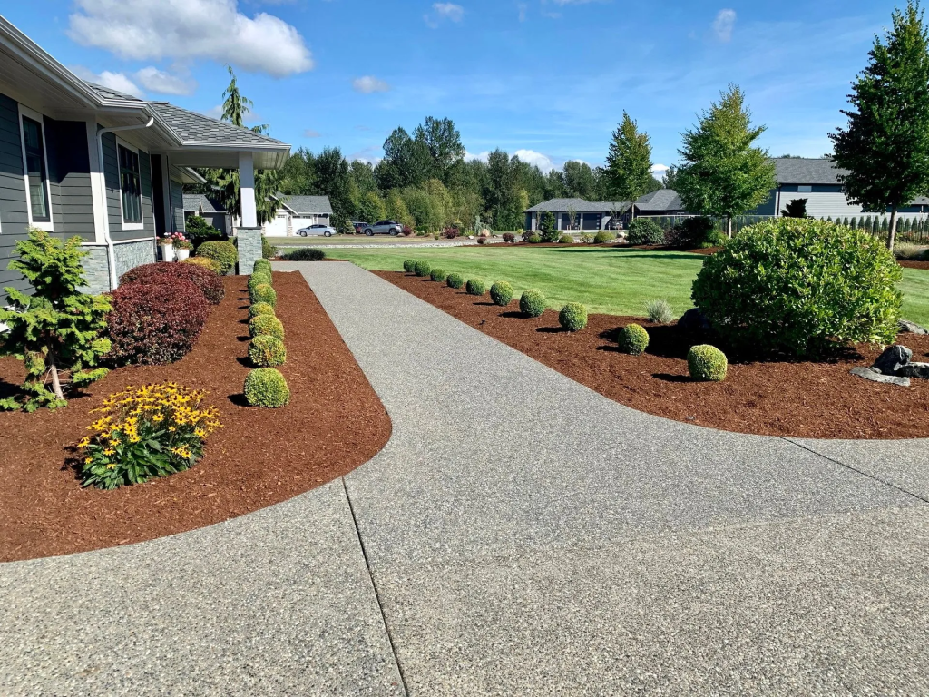 front of a house just landscaped by a pro